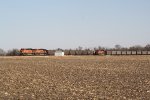 BNSF 6030 & 6092 bring a load of coal empties west past an eastbound coal train being pushed by BNSF 6184